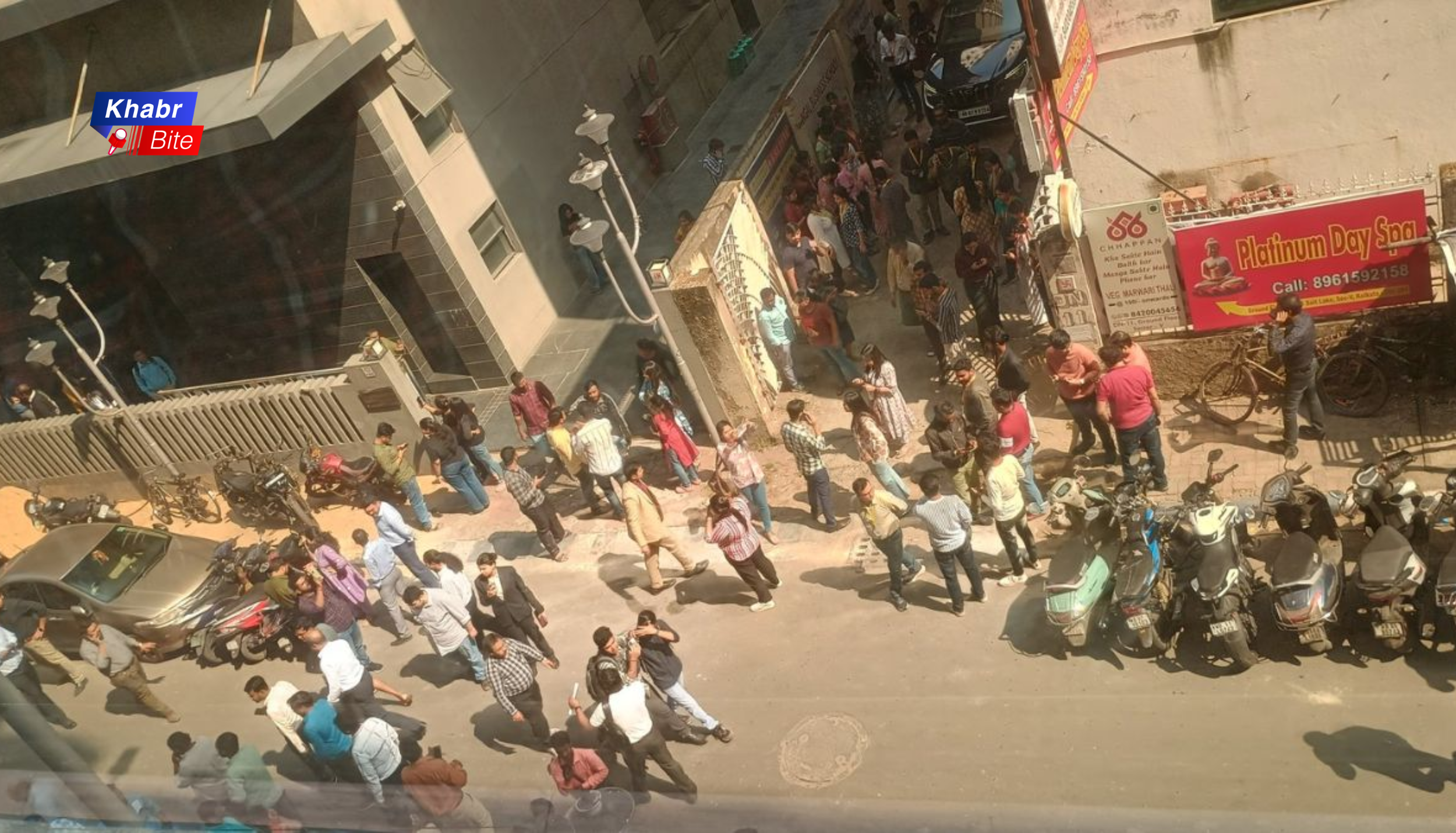 People gathered outside buildings after earthquake tremors in Kolkata