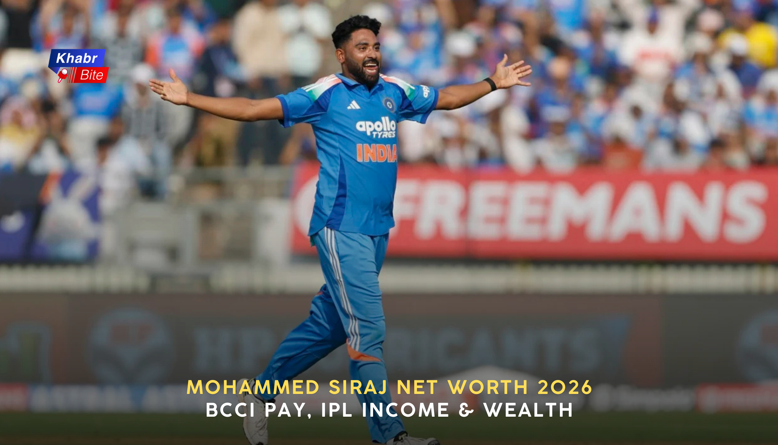 Mohammed Siraj celebrating on the cricket field in India jersey with arms outstretched during a match.