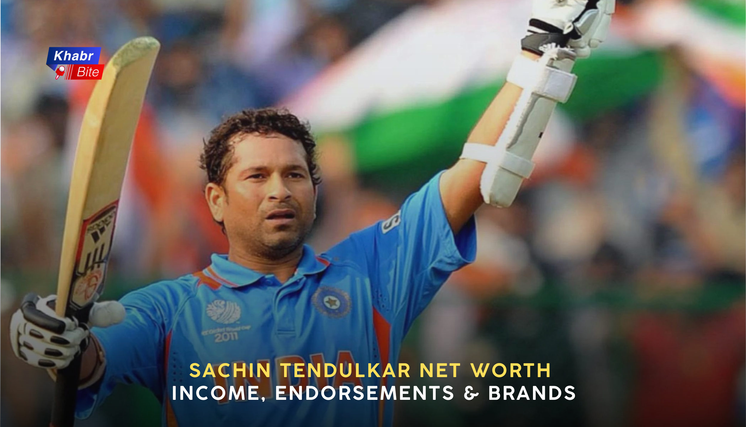 Sachin Tendulkar celebrating century in India jersey with bat raised