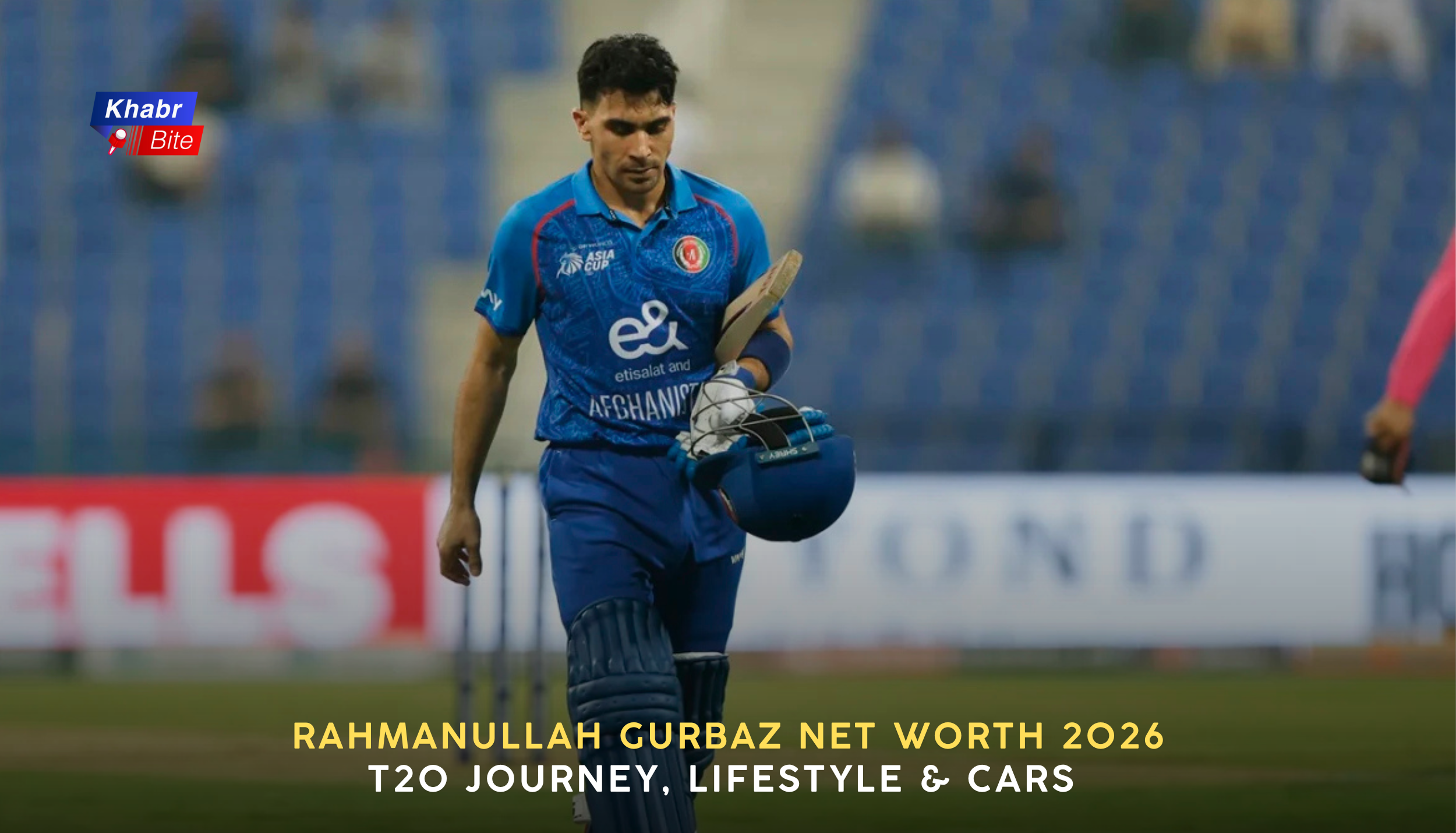 Rahmanullah Gurbaz walking off the field with bat and helmet, wearing Afghanistan blue jersey during an international T20 cricket match in a stadium.