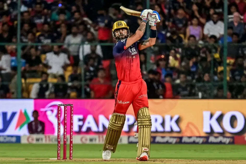 Virat Kohli playing a shot in RCB jersey during IPL match