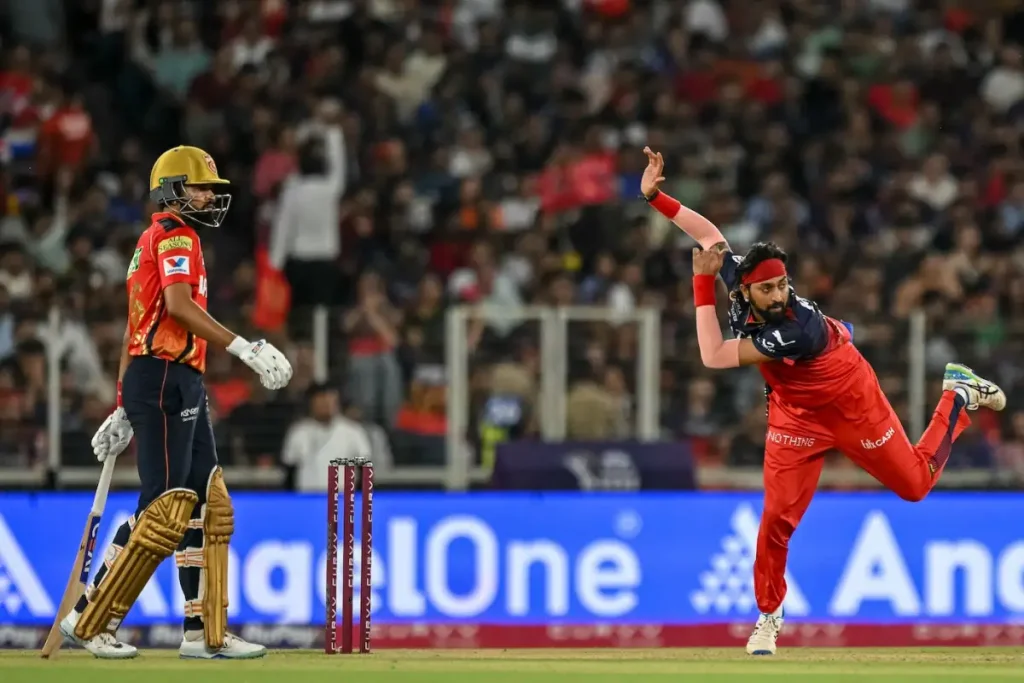 RCB bowler in action as SRH batter watches during IPL match