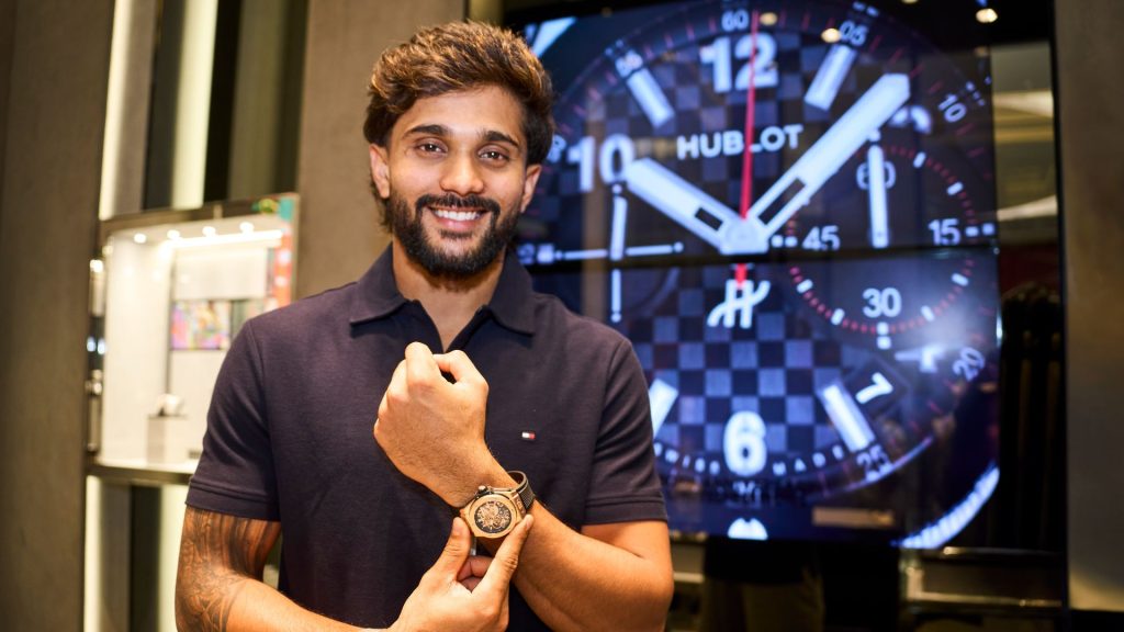 Nitish Kumar Reddy posing with luxury watch during brand endorsement event