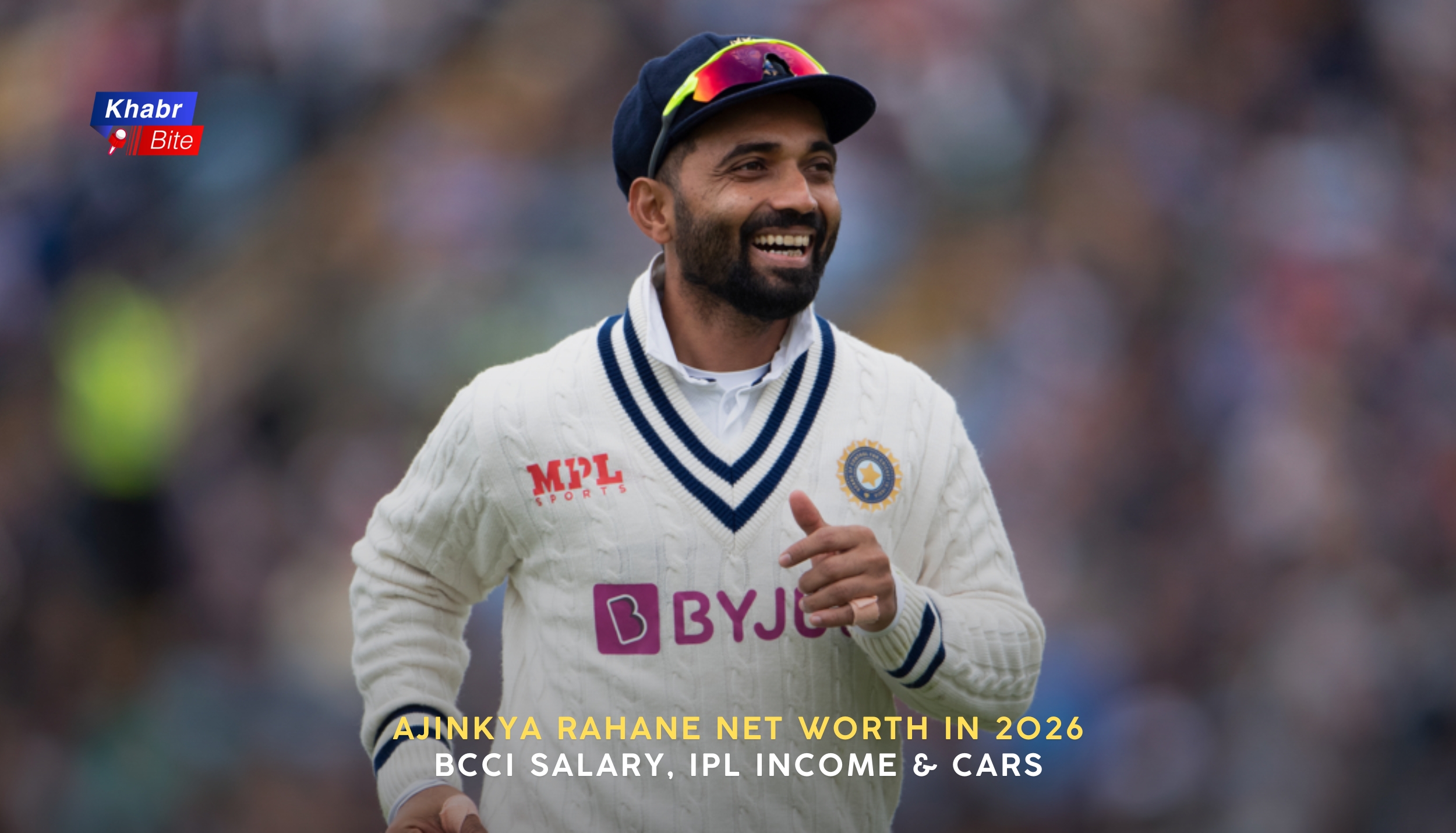 Ajinkya Rahane smiling in Indian Test jersey during a match