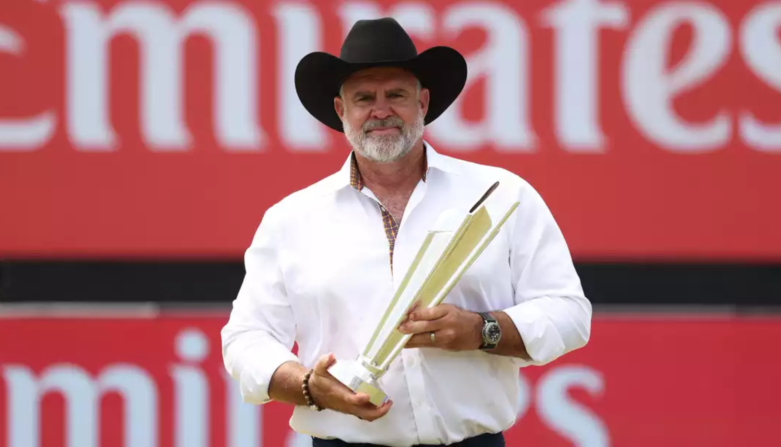 Matthew Hayden poses with a trophy after being appointed Gujarat Titans batting coach ahead of IPL 2026