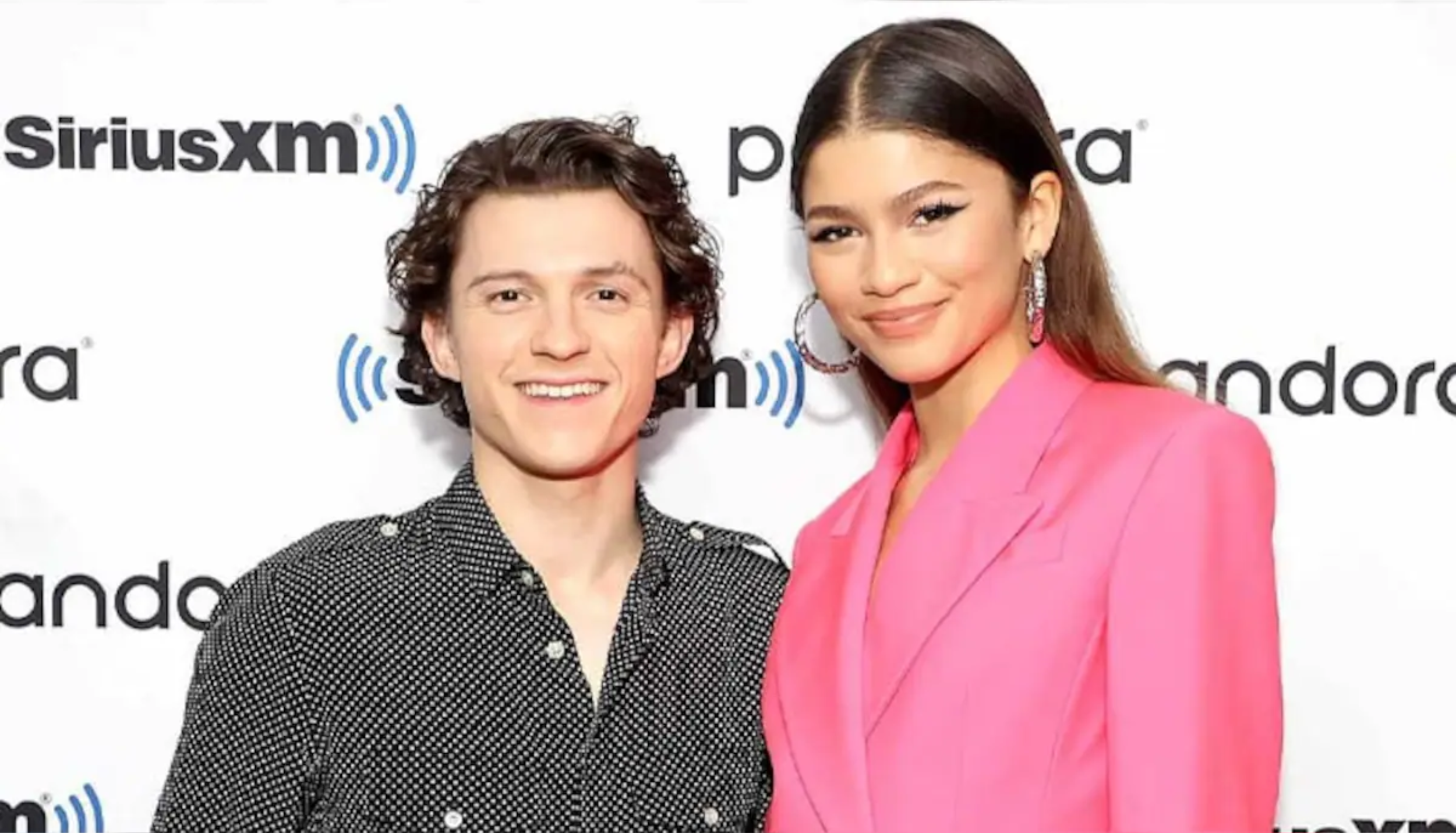Zendaya and Tom Holland posing together at a public event amid marriage rumours